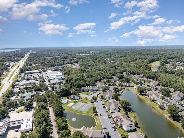 drone / aerial view with a water view and a residential view