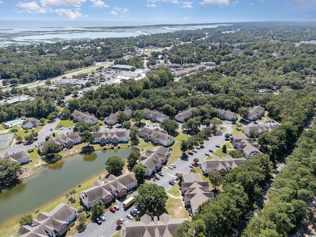 drone / aerial view with a water view and a residential view