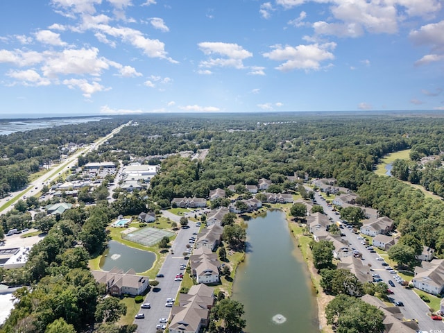 drone / aerial view featuring a water view and a residential view