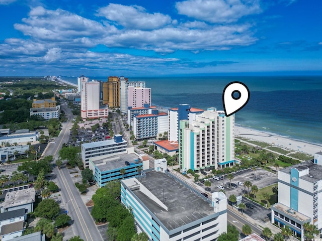 birds eye view of property with a view of the beach and a water view