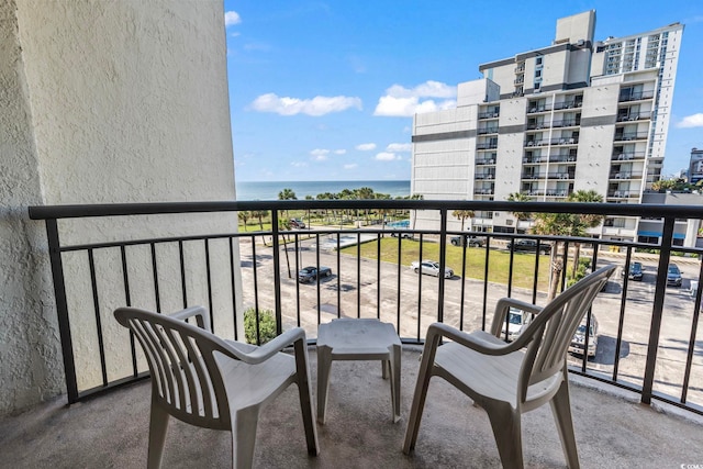 balcony featuring a water view