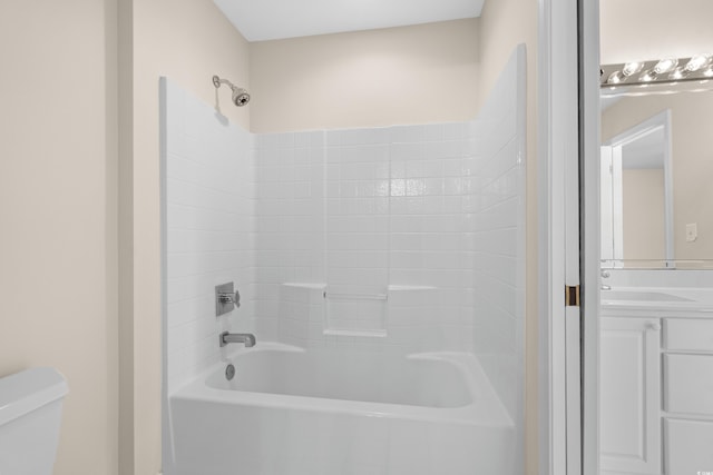 full bathroom with toilet, vanity, and shower / bathtub combination