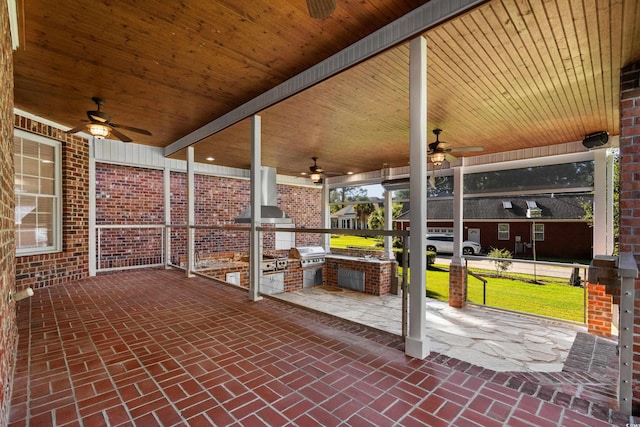 view of patio featuring a grill, area for grilling, and ceiling fan