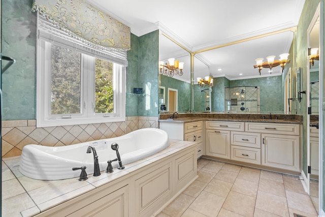 bathroom featuring plus walk in shower, tile patterned flooring, ornamental molding, an inviting chandelier, and vanity