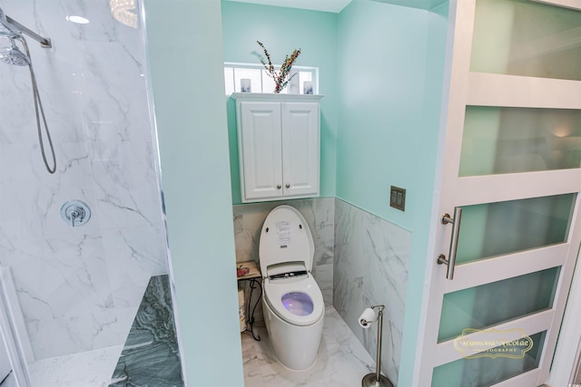 bathroom featuring tile walls, toilet, and tiled shower