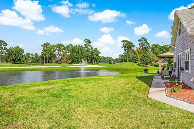 view of yard with a gazebo and a water view