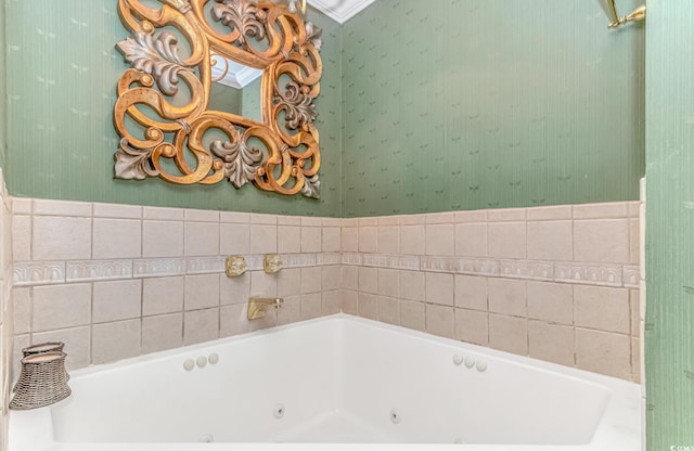 bathroom with a bathtub and ornamental molding