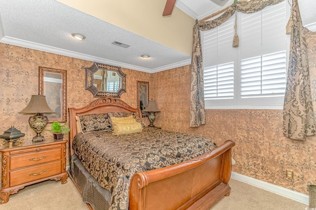 carpeted bedroom with ceiling fan, crown molding, and a textured ceiling