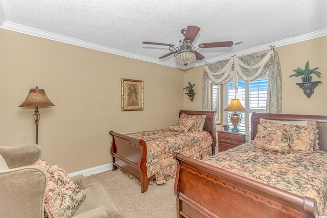 carpeted bedroom with ceiling fan, a textured ceiling, and crown molding