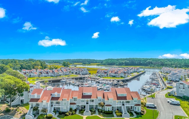 birds eye view of property with a water view