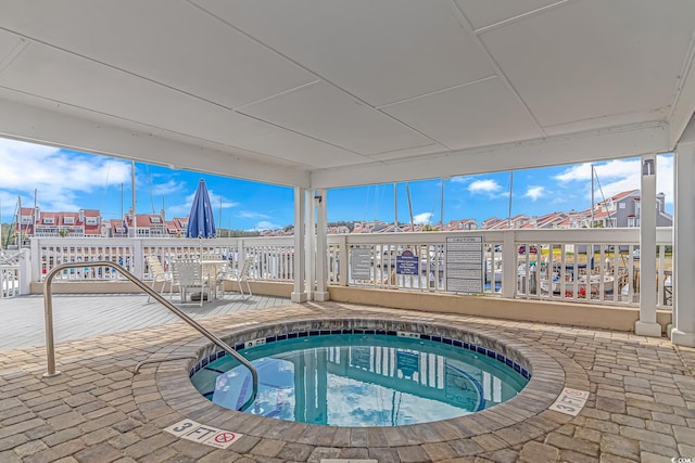 view of pool featuring a hot tub