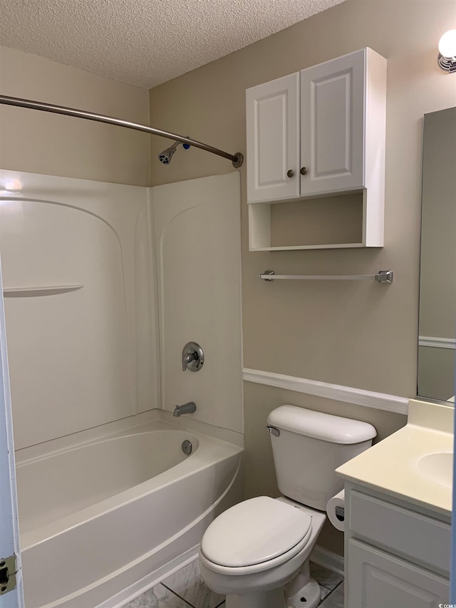 full bathroom with shower / tub combination, vanity, a textured ceiling, and toilet