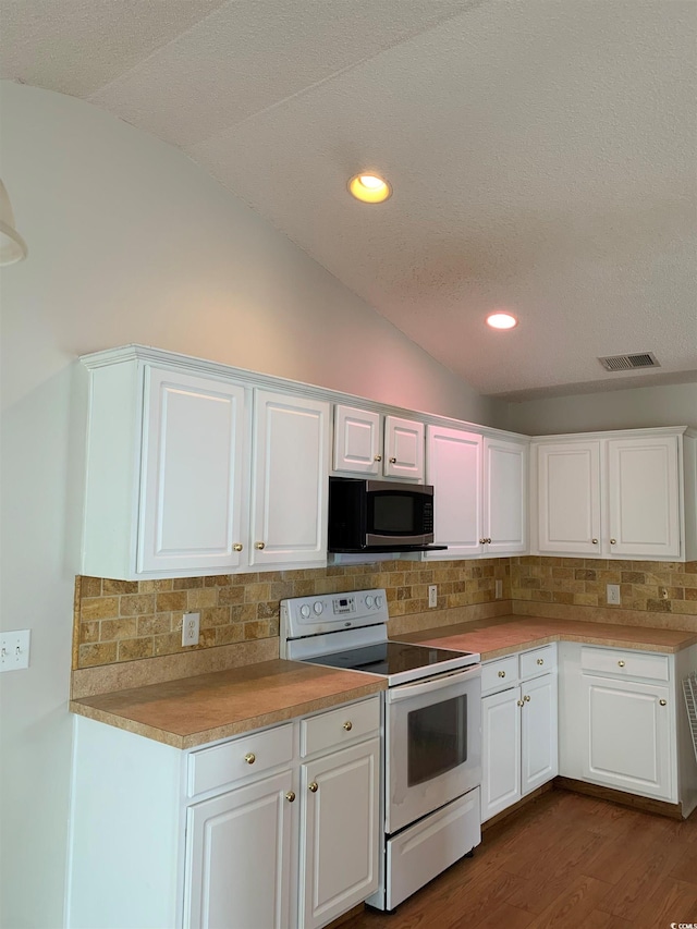 kitchen featuring white cabinets and white electric range oven