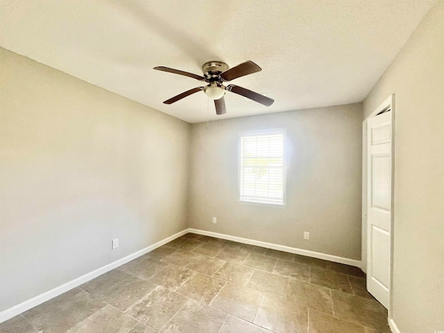 unfurnished room with ceiling fan