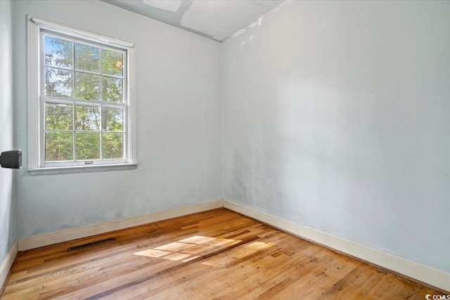 spare room with light hardwood / wood-style flooring