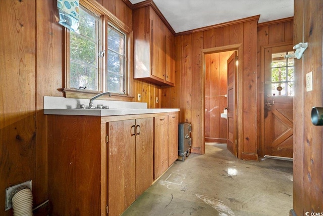 kitchen with wooden walls and crown molding