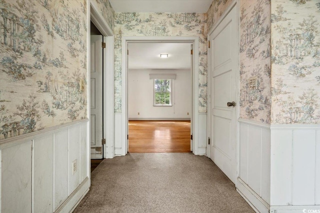 hallway with wood-type flooring