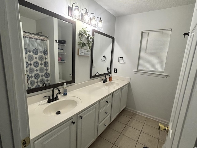 2108 Kirkland Dr, Conway, SC 29526 - bathroom featuring a sink, tile patterned flooring, a textured ceiling, and double vanity