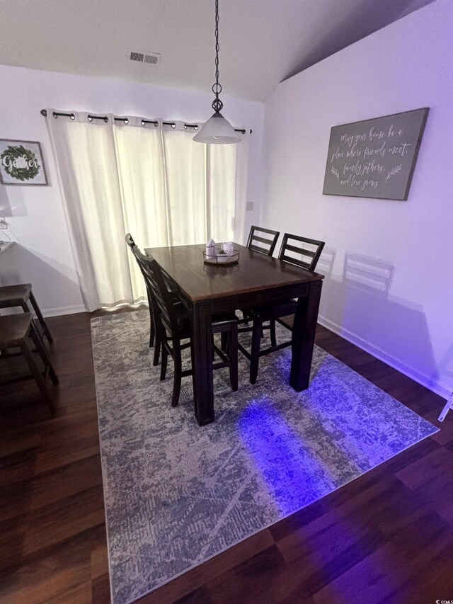 2108 Kirkland Dr, Conway, SC 29526 - dining area featuring vaulted ceiling, dark wood-style flooring, baseboards, and visible vents