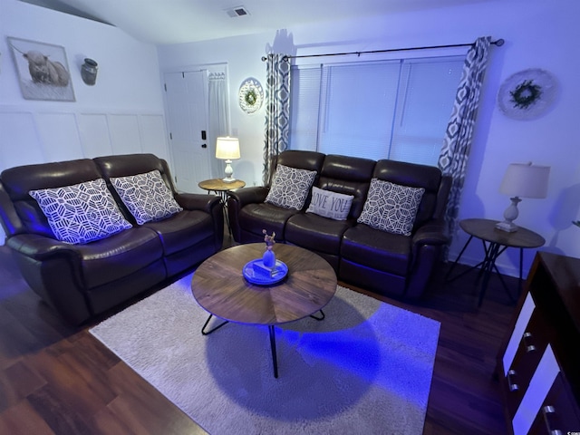 living room with dark wood-type flooring