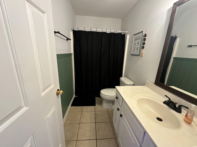 2108 Kirkland Dr, Conway, SC 29526 - bathroom with toilet, a wainscoted wall, vanity, a textured ceiling, and tile patterned floors