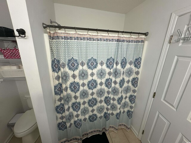 2108 Kirkland Dr, Conway, SC 29526 - full bath with toilet, baseboards, tile patterned floors, and a shower with shower curtain