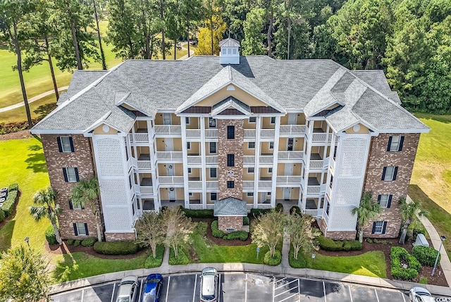 4870 Luster Leaf Cir Unit 401, Myrtle Beach, SC 29577 - view of building exterior with uncovered parking