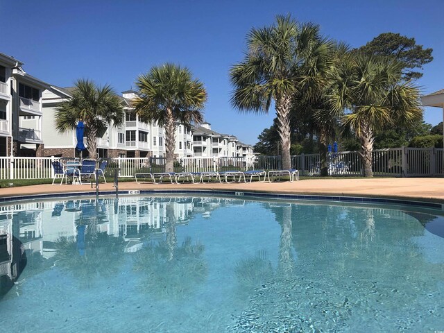 4870 Luster Leaf Cir Unit 401, Myrtle Beach, SC 29577 - community pool featuring fence