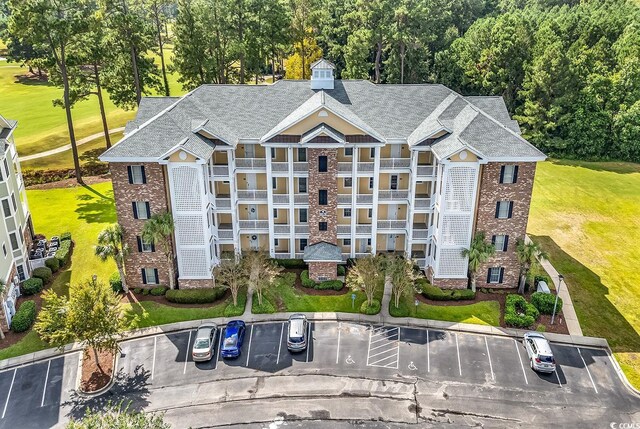 4870 Luster Leaf Cir Unit 401, Myrtle Beach, SC 29577 - view of property featuring uncovered parking