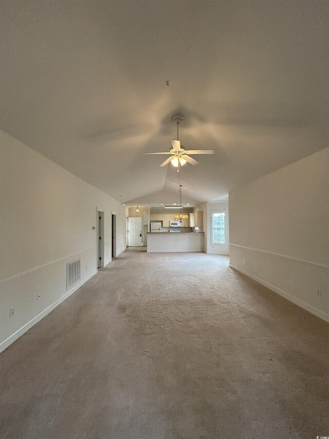 4870 Luster Leaf Cir Unit 401, Myrtle Beach, SC 29577 - unfurnished living room with lofted ceiling, ceiling fan, light colored carpet, and baseboards