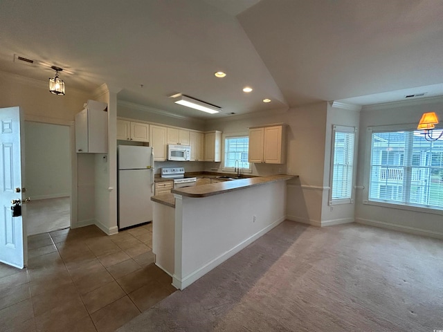 kitchen with ornamental molding, white appliances, kitchen peninsula, and light tile patterned floors