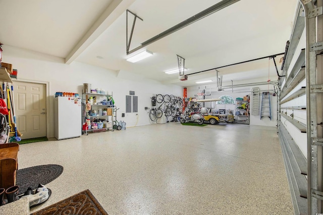 1324 Harbour Watch SW, Calabash, NC 28467 - garage with freestanding refrigerator, electric panel, and a garage door opener