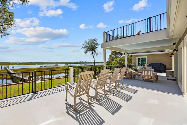 1324 Harbour Watch SW, Calabash, NC 28467 - view of patio / terrace with a balcony and a water view