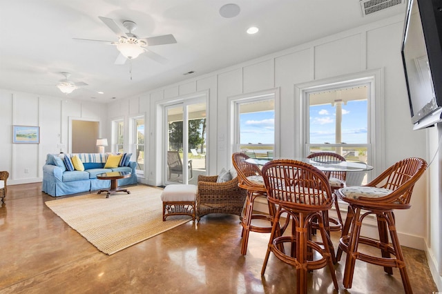 1324 Harbour Watch SW, Calabash, NC 28467 - dining area with a decorative wall, finished concrete flooring, ceiling fan, and recessed lighting