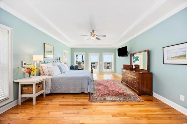 1324 Harbour Watch SW, Calabash, NC 28467 - bedroom featuring a tray ceiling, wood finished floors, ornamental molding, baseboards, and ceiling fan