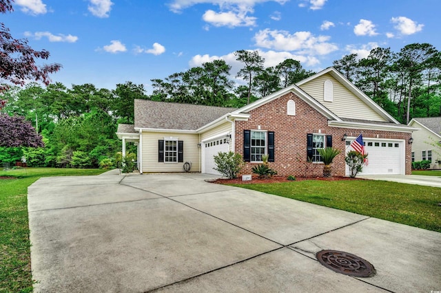 view of front of property with a front yard and a garage