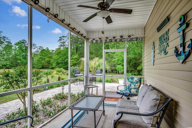 sunroom / solarium with ceiling fan