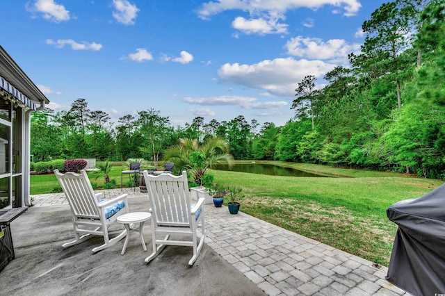 view of patio featuring a water view