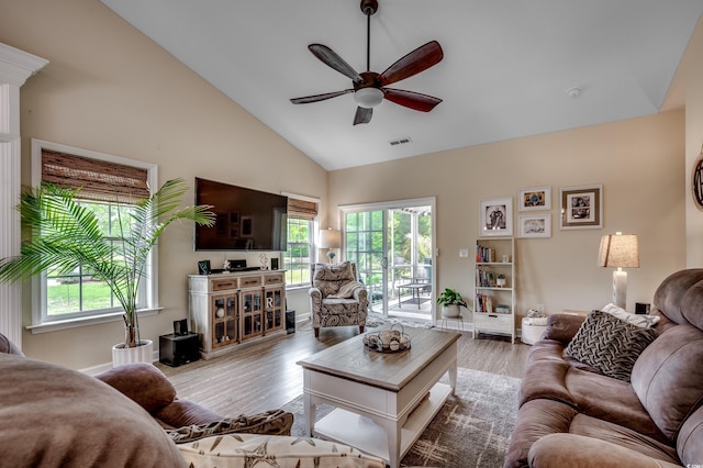 living room featuring high vaulted ceiling, ceiling fan, and hardwood / wood-style flooring