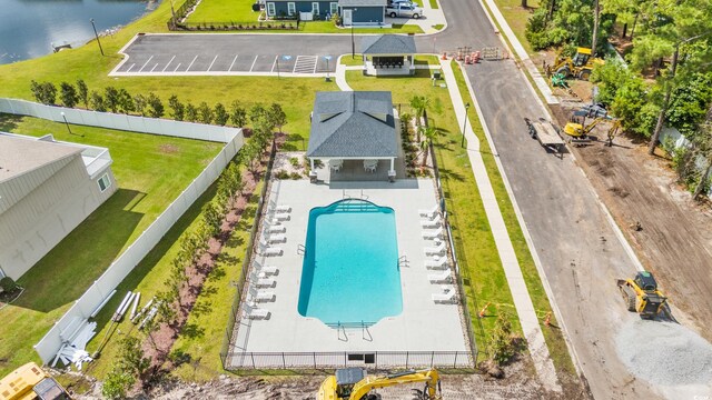 birds eye view of property with a water view