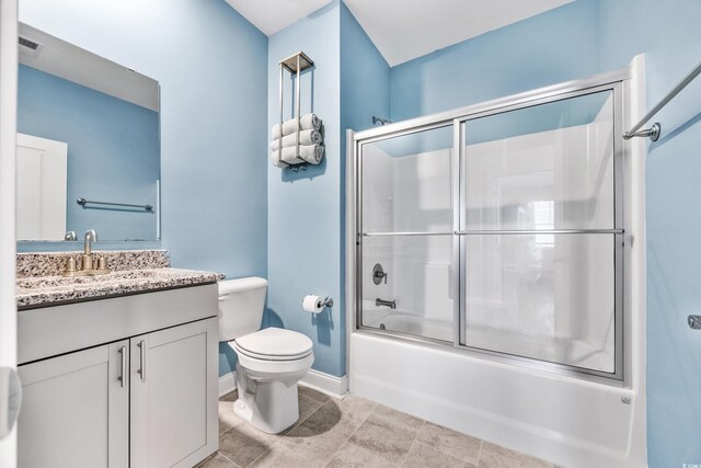 full bathroom featuring shower / bath combination with glass door, vanity, and toilet