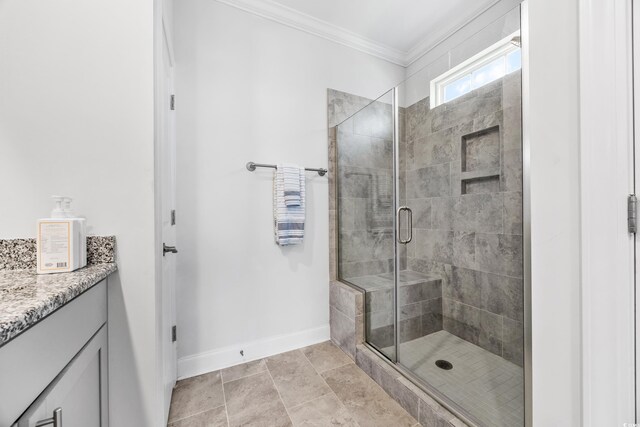 bathroom with crown molding, vanity, and a shower with shower door