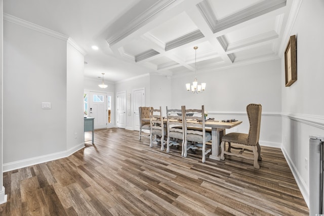 dining room featuring beamed ceiling, dark hardwood / wood-style floors, a chandelier, and crown molding