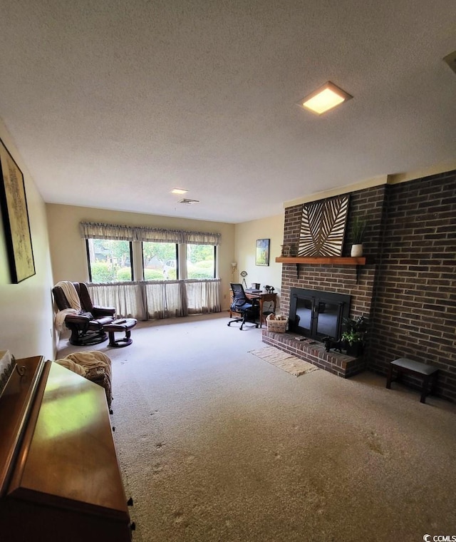 carpeted living room with a textured ceiling and a fireplace