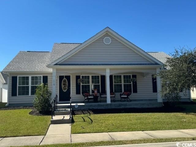 view of front of house with a front lawn and covered porch