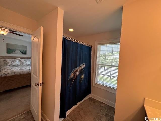 bathroom with vanity and ceiling fan