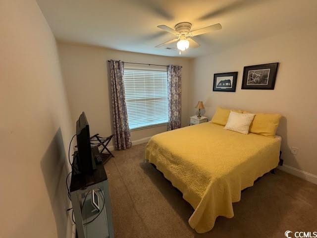 carpeted bedroom featuring ceiling fan