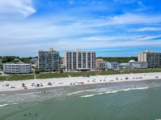 birds eye view of property featuring a view of the beach and a water view