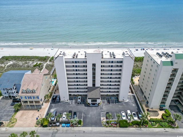 aerial view featuring a view of the beach and a water view