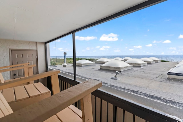 balcony featuring a water view